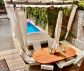 Two storey apartment with garden and pool